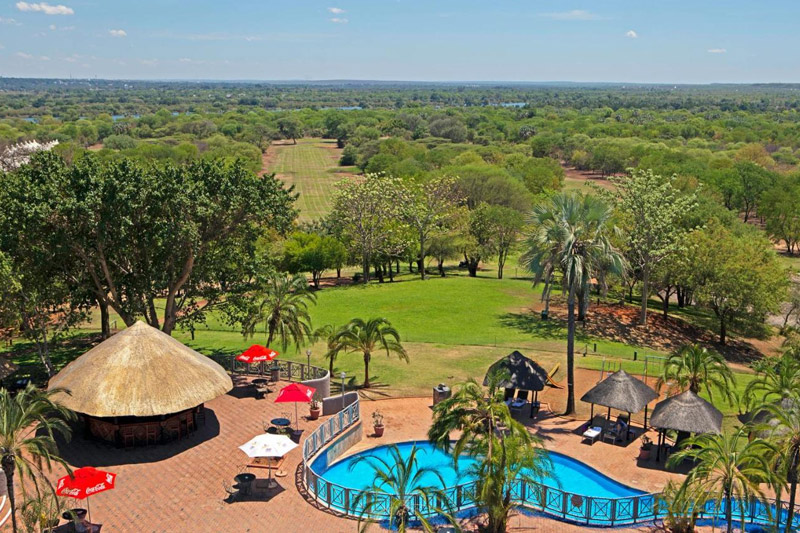 View of the swimming pool and the golf course from the deck of the elephant hills